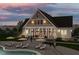 Sunset view of this lovely home with a deck, pool and ample lounge chairs at 1170 Holding Village Way, Wake Forest, NC 27587