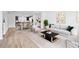 Bright living room showcasing an open floor plan, modern decor and wood-style flooring at 1170 Holding Village Way, Wake Forest, NC 27587