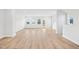 Spacious, light-filled living room with hardwood floors and multiple windows at 1170 Holding Village Way, Wake Forest, NC 27587