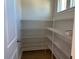 Spacious walk-in pantry featuring wire shelving and ample storage space at 1170 Holding Village Way, Wake Forest, NC 27587