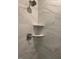 Close up of tiled shower with a shower head and corner shelves at 1170 Holding Village Way, Wake Forest, NC 27587