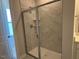 New shower with glass doors and tile walls at 1170 Holding Village Way, Wake Forest, NC 27587