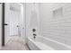 Clean bathroom with white subway tiles and a classic bathtub at 1610 Carson St, Raleigh, NC 27608