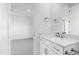 Vanity with white cabinets and quartz countertop at 1610 Carson St, Raleigh, NC 27608