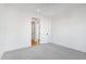 Spacious bedroom with carpet and access to hallway at 1610 Carson St, Raleigh, NC 27608