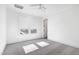 Bright bedroom with grey carpet, ceiling fan, and large windows at 1610 Carson St, Raleigh, NC 27608