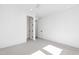 Bright bedroom with carpet flooring and access to hallway at 1610 Carson St, Raleigh, NC 27608