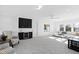 Spacious bonus room with comfy seating and wet bar at 1610 Carson St, Raleigh, NC 27608