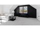 Bright bonus room features a cozy sectional sofa and stylish built-in bench at 1610 Carson St, Raleigh, NC 27608