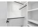 Bright closet with built-in shelves and hanging rods at 1610 Carson St, Raleigh, NC 27608