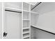 Spacious closet with built-in shelves and hanging rods at 1610 Carson St, Raleigh, NC 27608