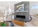 Modern fireplace with gray marble surround and built-in shelving at 1610 Carson St, Raleigh, NC 27608