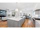Open concept kitchen features island, dining area, and Gathering room at 1610 Carson St, Raleigh, NC 27608