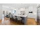 Modern kitchen with white cabinetry, a large island, and hardwood floors at 1610 Carson St, Raleigh, NC 27608
