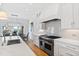High-end kitchen with stainless steel range and white cabinetry at 1610 Carson St, Raleigh, NC 27608