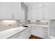 White kitchen cabinets, quartz countertops, and gray tile backsplash at 1610 Carson St, Raleigh, NC 27608