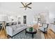 Open living area with a comfy sofa, a coffee table, and hardwood floors at 1610 Carson St, Raleigh, NC 27608
