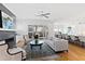Spacious living room features a fireplace, hardwood floors, and access to a deck at 1610 Carson St, Raleigh, NC 27608