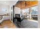 Covered patio with fireplace, comfortable seating, and wood ceiling at 1610 Carson St, Raleigh, NC 27608