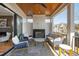 Relaxing covered patio with fireplace and comfortable seating area at 1610 Carson St, Raleigh, NC 27608