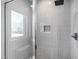 Modern shower with gray tile and glass enclosure at 1610 Carson St, Raleigh, NC 27608