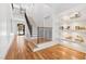 Modern staircase with a metal railing and built-in shelving at 1610 Carson St, Raleigh, NC 27608