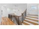 Elegant staircase with wood steps and metal railing at 1610 Carson St, Raleigh, NC 27608