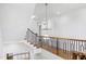 Modern staircase with a light and airy feel, featuring a stylish chandelier at 1610 Carson St, Raleigh, NC 27608