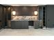 Stylish bar area with marble countertop, custom cabinetry, and modern pendant lighting at 65 Firefly Overlook, Pittsboro, NC 27312