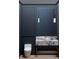 A modern powder room with a floating marble vanity and stylish pendant lighting at 65 Firefly Overlook, Pittsboro, NC 27312