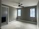 Bedroom with two windows, providing ample natural light into the spacious room at 65 Firefly Overlook, Pittsboro, NC 27312