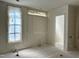 Bedroom featuring a window and an open doorway at 65 Firefly Overlook, Pittsboro, NC 27312
