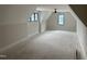 Expansive bonus room with dormer windows and a ceiling fan, perfect for flexible living at 65 Firefly Overlook, Pittsboro, NC 27312