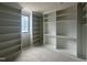 Spacious walk-in closet with ample shelving and natural light, ready for organization at 65 Firefly Overlook, Pittsboro, NC 27312