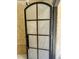 View of a black framed door, featuring frosted window panes, waiting for installation at 65 Firefly Overlook, Pittsboro, NC 27312
