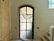 Entryway showcasing an arched glass door and sidelight under protective plastic at 65 Firefly Overlook, Pittsboro, NC 27312
