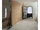 Entryway featuring a modern arched door and sidelight, complemented by natural light at 65 Firefly Overlook, Pittsboro, NC 27312