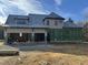 House under construction, showcasing a large two-story home with a steeply pitched roof at 65 Firefly Overlook, Pittsboro, NC 27312