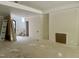 Unfinished Living Room with lots of natural light, ready for your personal touch at 65 Firefly Overlook, Pittsboro, NC 27312