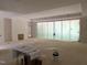 Spacious living room showcasing large sliding doors covered during construction, offering ample natural light at 65 Firefly Overlook, Pittsboro, NC 27312