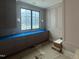 Well-lit mud room featuring custom cabinetry, a large window, and elegant trim, adding functional style to the home at 65 Firefly Overlook, Pittsboro, NC 27312