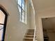 Staircase featuring a large window providing natural light, and classic design elements at 65 Firefly Overlook, Pittsboro, NC 27312