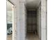 Empty walk-in closet featuring open shelving during construction phase at 65 Firefly Overlook, Pittsboro, NC 27312