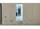 Walk-in closet with storage shelving during the final stages of construction at 65 Firefly Overlook, Pittsboro, NC 27312