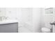 Bathroom with modern vanity, toilet, shower over tub, and sleek fixtures creating a serene atmosphere at 1873 Old Fields Blvd, Haw River, NC 27258