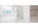Bathroom featuring a tiled shower, soaker tub, and tile flooring at 1873 Old Fields Blvd, Haw River, NC 27258