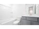 Bathroom featuring shower over tub, modern vanity, toilet, and sleek fixtures at 1873 Old Fields Blvd, Haw River, NC 27258