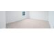 Bedroom features neutral carpet and a window providing natural light at 1873 Old Fields Blvd, Haw River, NC 27258