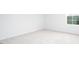Bedroom with neutral carpet and large window providing ample natural light at 1873 Old Fields Blvd, Haw River, NC 27258