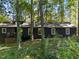 Dark-colored house with deck nestled in a wooded area at 9601 Leslie Dr, Chapel Hill, NC 27516